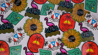 Colorful AQWA brand stickers featuring tropical designs, flamingos, sunflowers, and Puerto Rico themes.