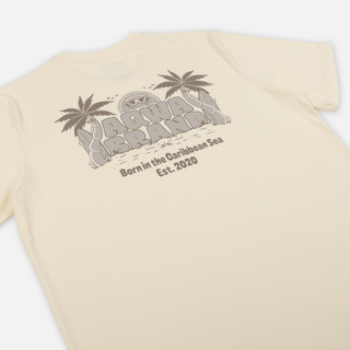 Angled back view of AQWA cream surf tee showing the full print and relaxed fit – for those who ride waves and chill under palms.