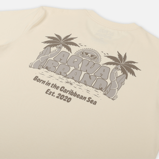 Close-up of back print on AQWA cream t-shirt featuring palm trees, sun with sunglasses, and bold brand lettering – playful island vibes.
