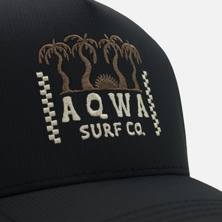 AQWA Surf Co. black hat with embroidered palm tree logo – perfect for coastal hikes and sunny beach days.