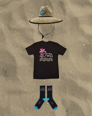 Black AQWA t-shirt with tropical pink logo, straw hat, and matching socks. Perfect for a laid-back beach or summer style.