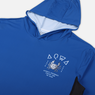 Close-up of chest logo featuring crab and maritime design on AQWA blue rash guard – inspired by offshore fishing culture.