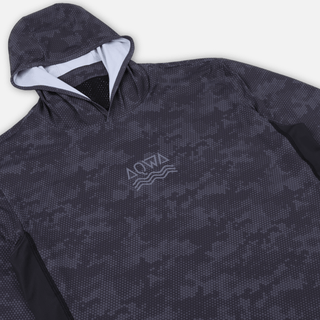 Angled close-up of AQWA rash guard – hood up, ready for coastal action and long days fishing.