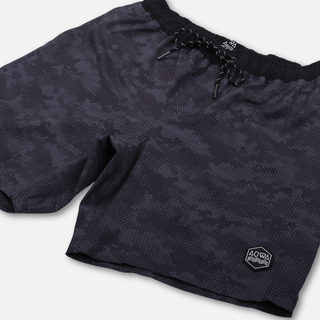 AQWA shorts shown from angled front – lightweight camo design with four-way stretch and adjustable waistband.
