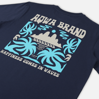 AQWA navy tee laid flat with bold palm tree print, inspired by tropical shores and beach life.