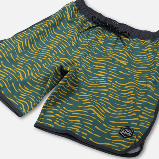 Angled front view of AQWA swim trunks highlighting curved hem and bold aquatic pattern.