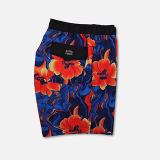 Folded side view of AQWA floral swim trunks displaying elastic waistband, leg opening, and side structure – tropical gear, compact.