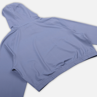 Close-up flat lay of AQWA women’s cropped lavender rash guard highlighting soft fabric and feminine fit – built for sun and sea.